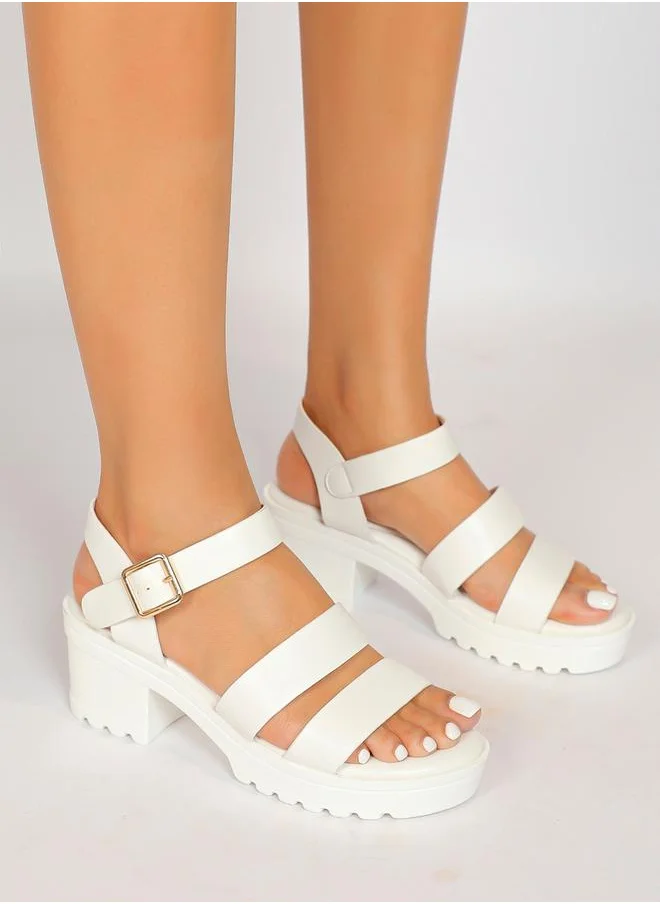 Sneak-a-Peek Solid Ankle Strap Block Heel Sandals by Styli