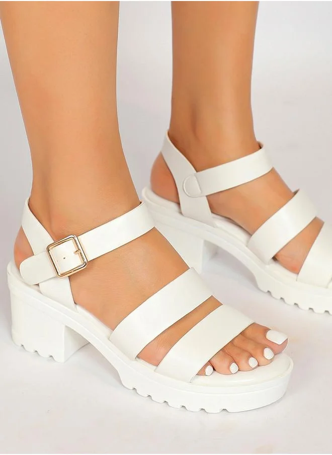Sneak-a-Peek Solid Ankle Strap Block Heel Sandals by Styli