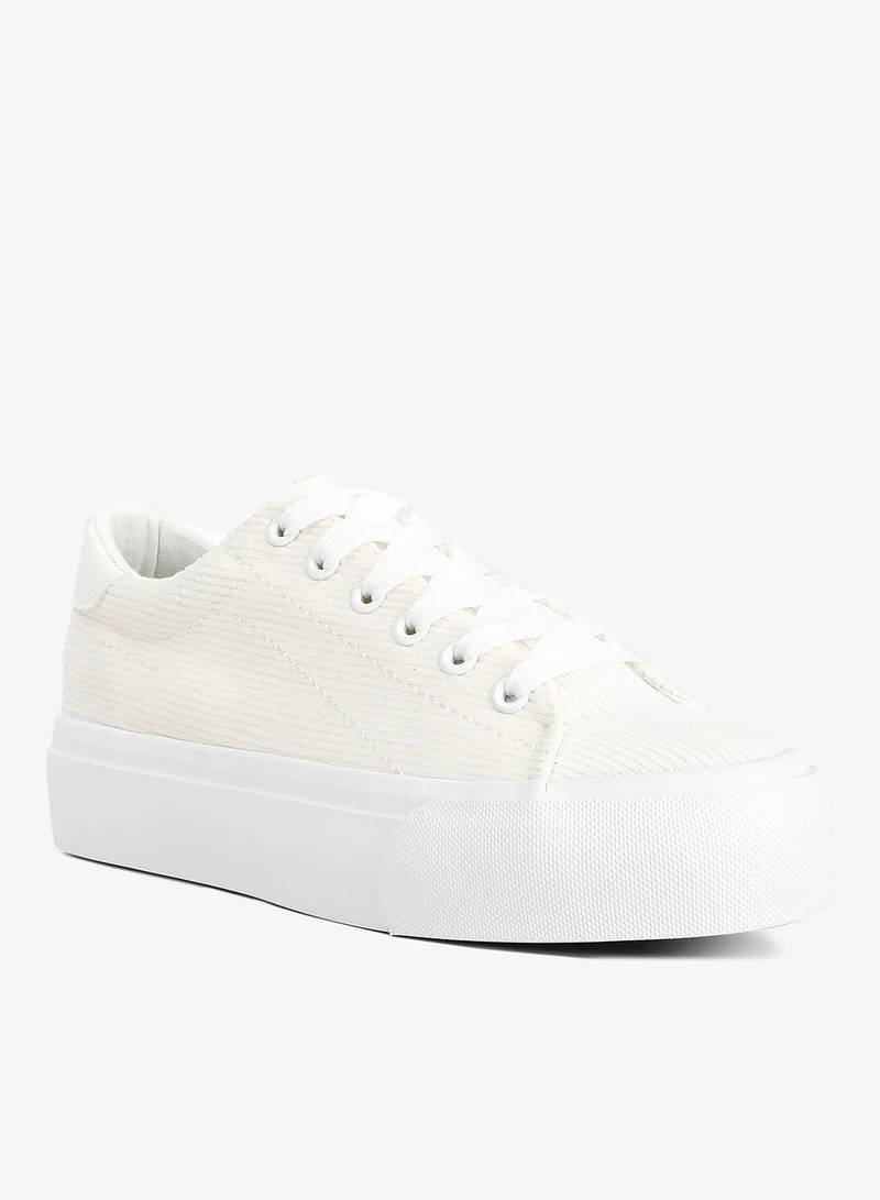 لندن راج أحذية رياضية بيضاء قماشية مسطحة