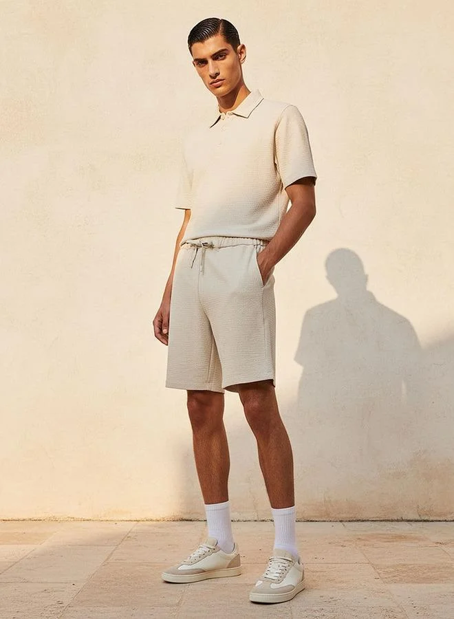 Iconic BEIGE Iconic Regular Fit Shorts for Men | Best Price UAE