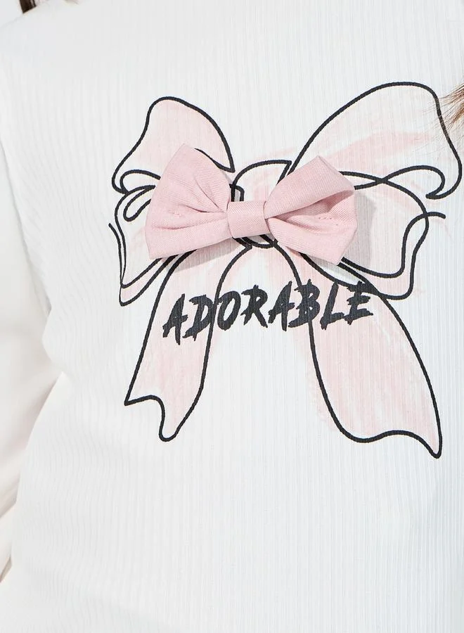 Styli Bow Applique Top & Asymmetric Waist Pleated Skirt Set