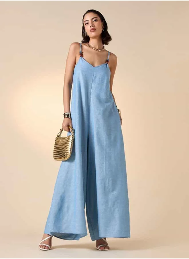 ايكونيك Iconic Sleeveless Jumpsuit with Bead and Tie-Up Detail