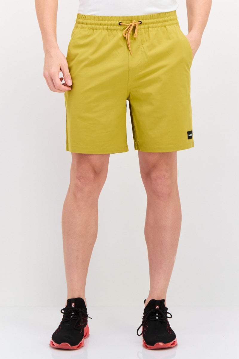 Hurley Men Sportswear Fit 18 Inseam Brand Logo Training Shorts, Mustard - Image 1