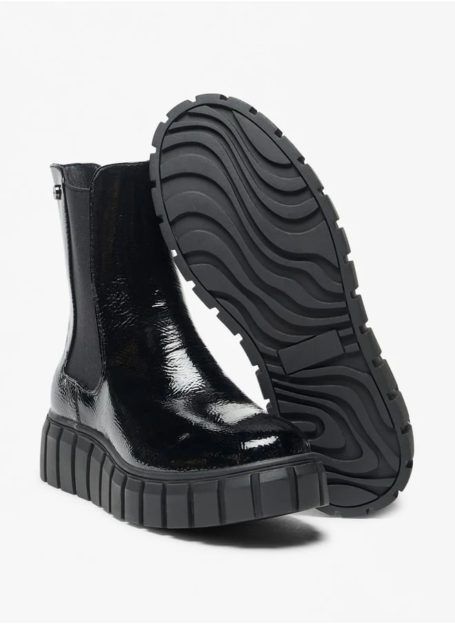 سيليست Women's Solid Slip-On Flatform Boots