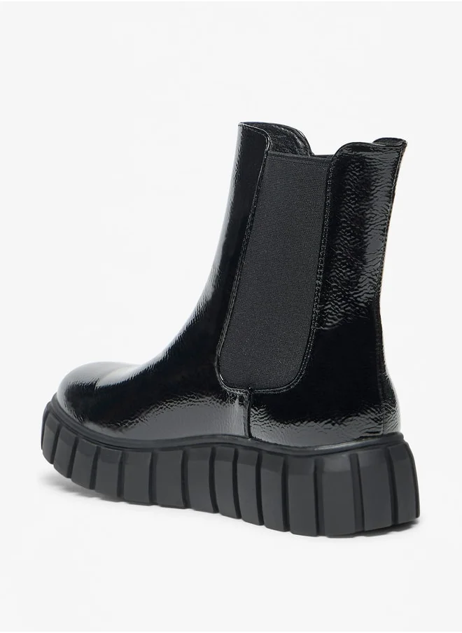 سيليست Women's Solid Slip-On Flatform Boots