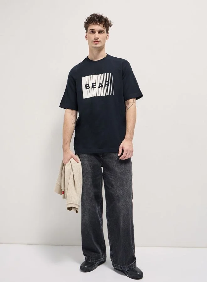 THE BEAR HOUSE  Men's Monochromatic Graphic Print Oversize Crew Neck T-shirt Perfect For Casual Wear, Gym, Travel, Or Layering Stylish And Versatile Essential For Every Wardrobe for Men | Best Price UAE