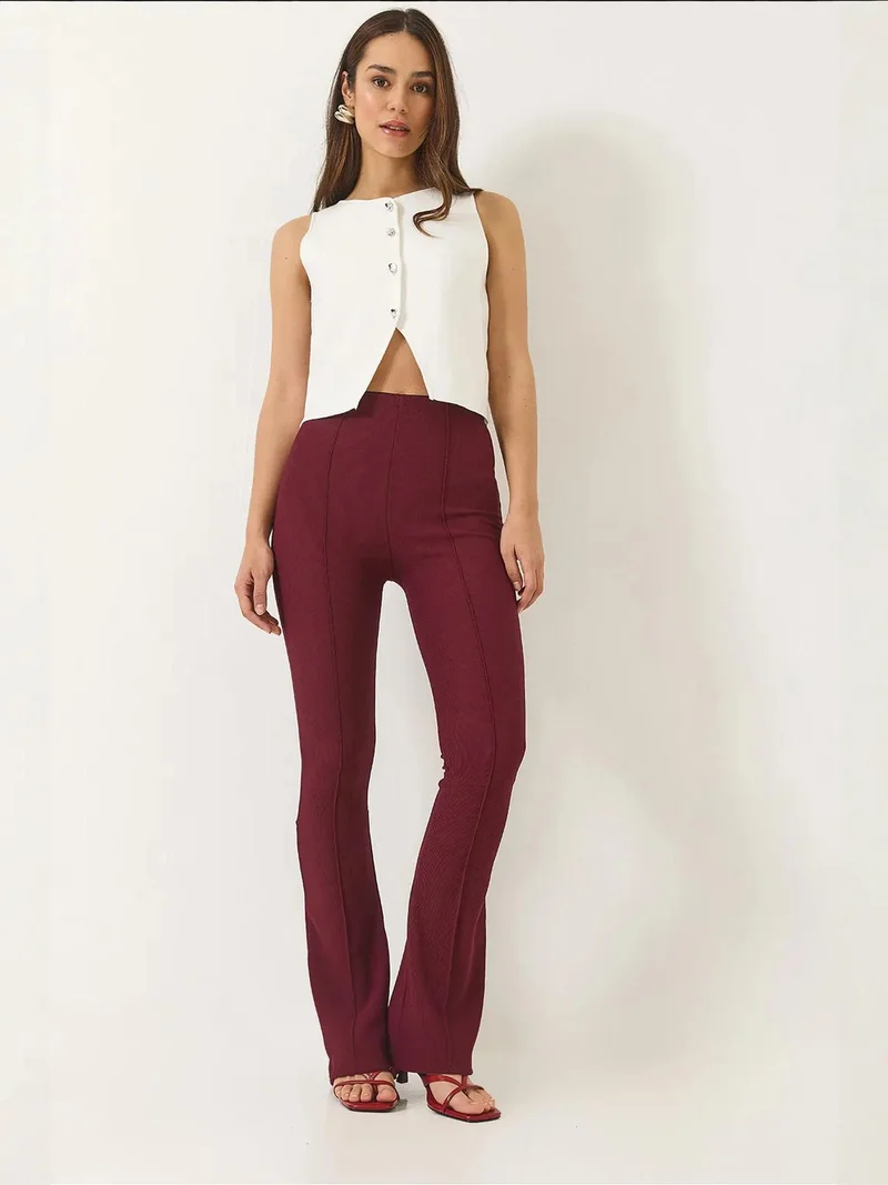 بيانكو لوتشي بنطلون واسع بخصر عالٍ من لوكسي بنسيج مضلع