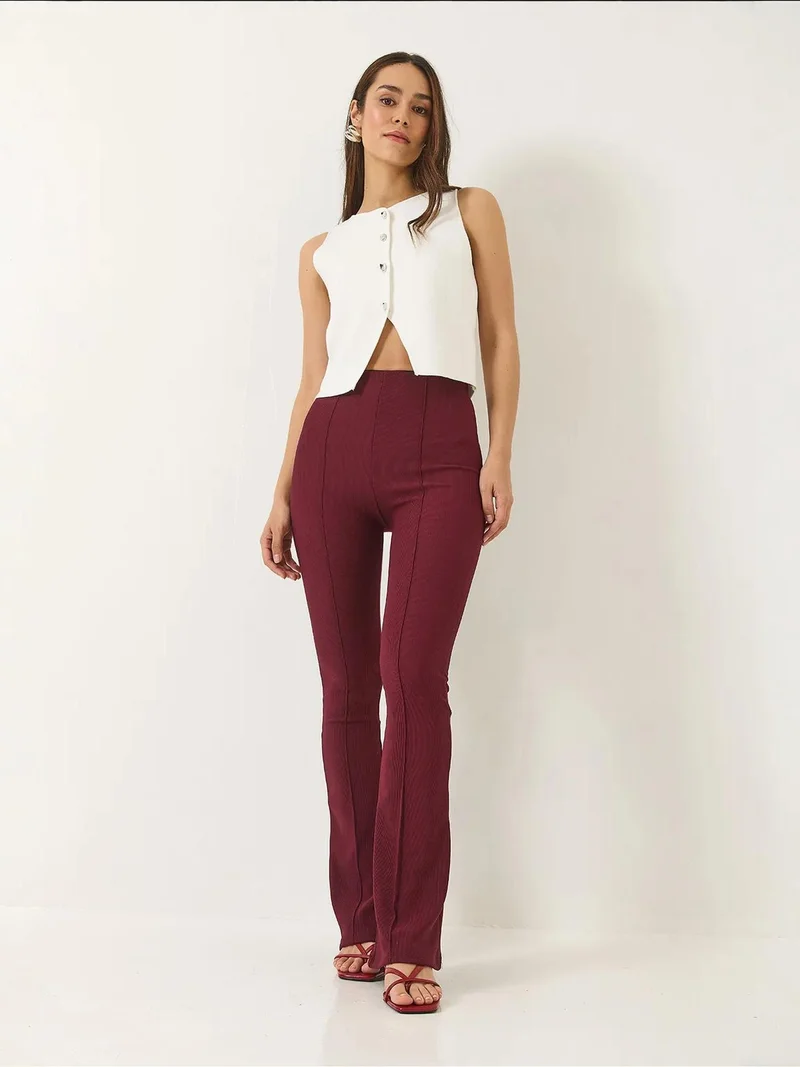 بيانكو لوتشي بنطلون واسع بخصر عالٍ من لوكسي بنسيج مضلع