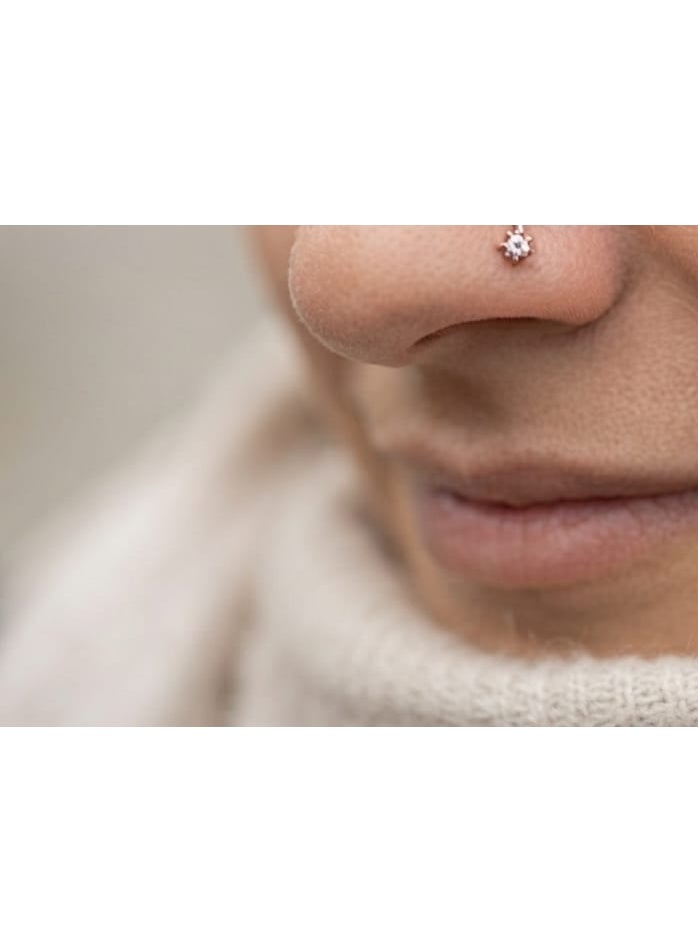 Luxuria Elegant women's nose ring with a small flower design adorned with shiny stones, giving a delicate and modern look, suitable for everyday use and occasions. - Image 2