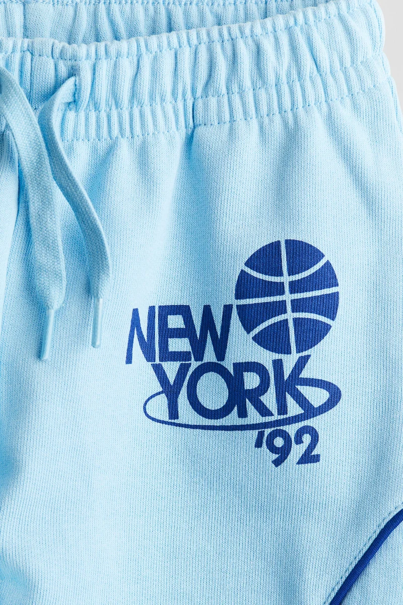 اتش اند ام بنطلون رياضي مزين بطبعة