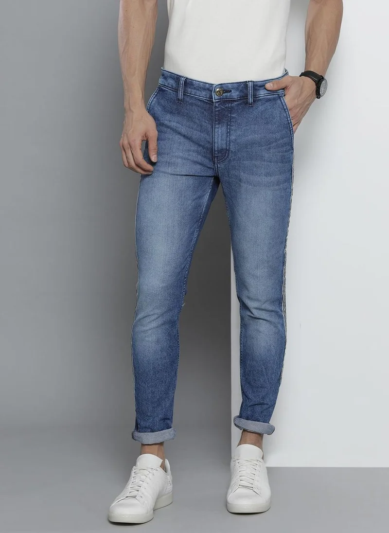 ذا انديان كراج كو Men Slim Fit Solid Mid-Rise Stretchable Jeans