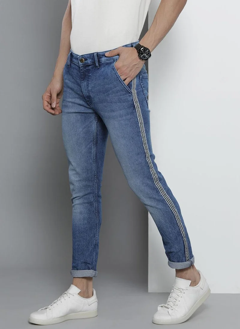 ذا انديان كراج كو Men Slim Fit Solid Mid-Rise Stretchable Jeans