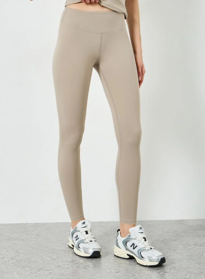 Styli Active  Beige Short Sleeve Fitted Top and Leggings Set for Women | Best Price UAE