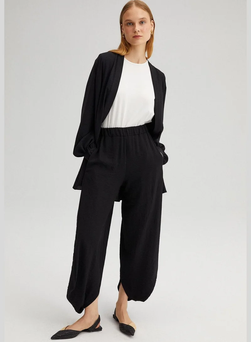 توتشي ELASTIC WAISTED BAGG TROUSERS