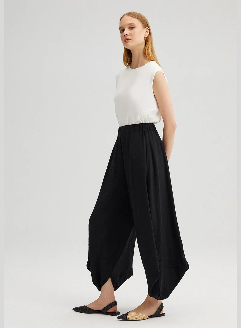 توتشي ELASTIC WAISTED BAGG TROUSERS