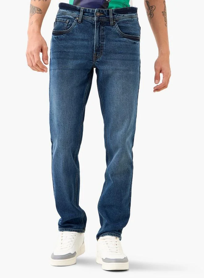 لي كوبر جينز لي كوبر بقصة ضيقة مع إغلاق بأزرار وجيوب