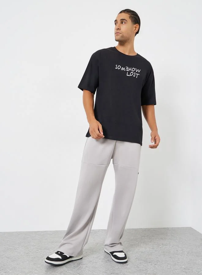 Styli Men Black Oversized Slogan Print T-Shirt