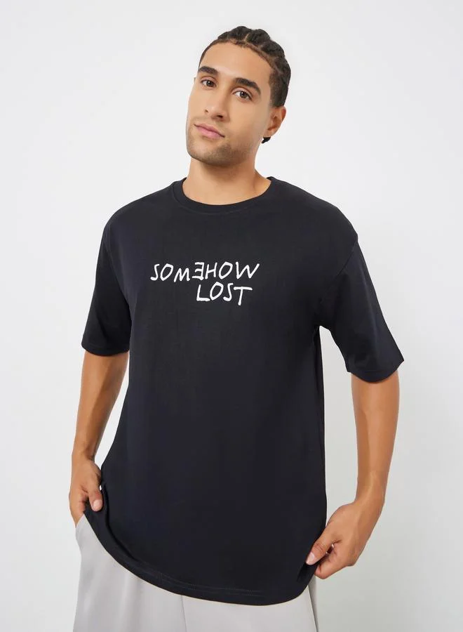 Styli Men Black Oversized Slogan Print T-Shirt