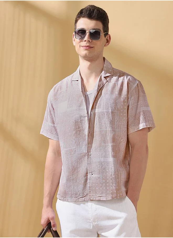 Dennis Lingo Relaxed Fit Printed Beige 100% cotton Regular Length Half Sleeves Cuban Collar Woven Weave Button Down for Men -a must-have piece for fashion-forward minds.
