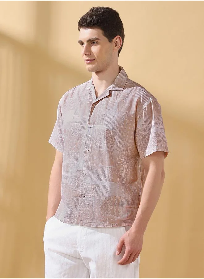 Dennis Lingo Relaxed Fit Printed Beige 100% cotton Regular Length Half Sleeves Cuban Collar Woven Weave Button Down for Men -a must-have piece for fashion-forward minds.