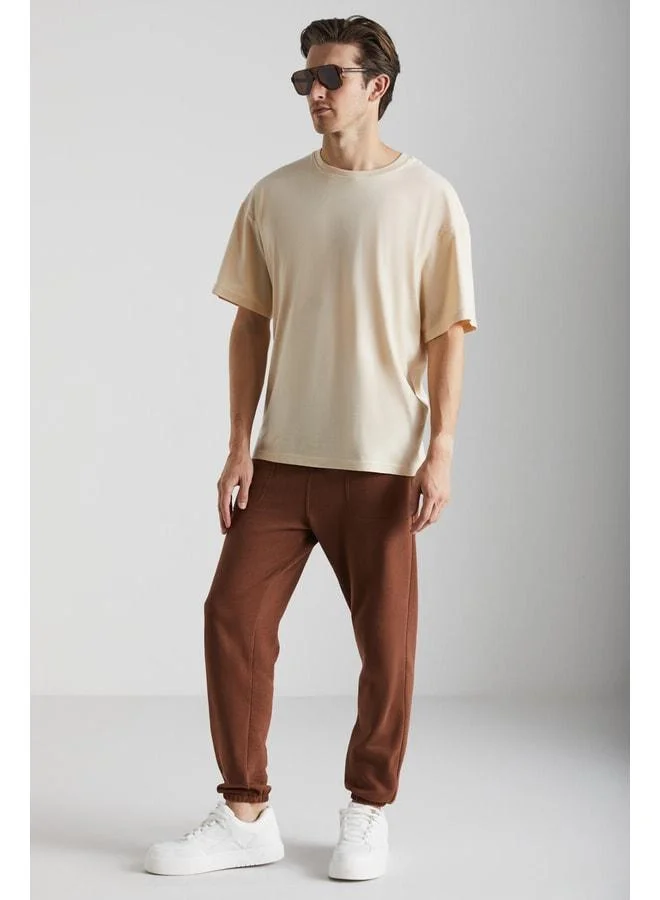 GRIMELANGE Goran Men's Organic Cotton Sweatpants with Polar Lining, Top Pockets, Elasticated Cuffs, Brown.