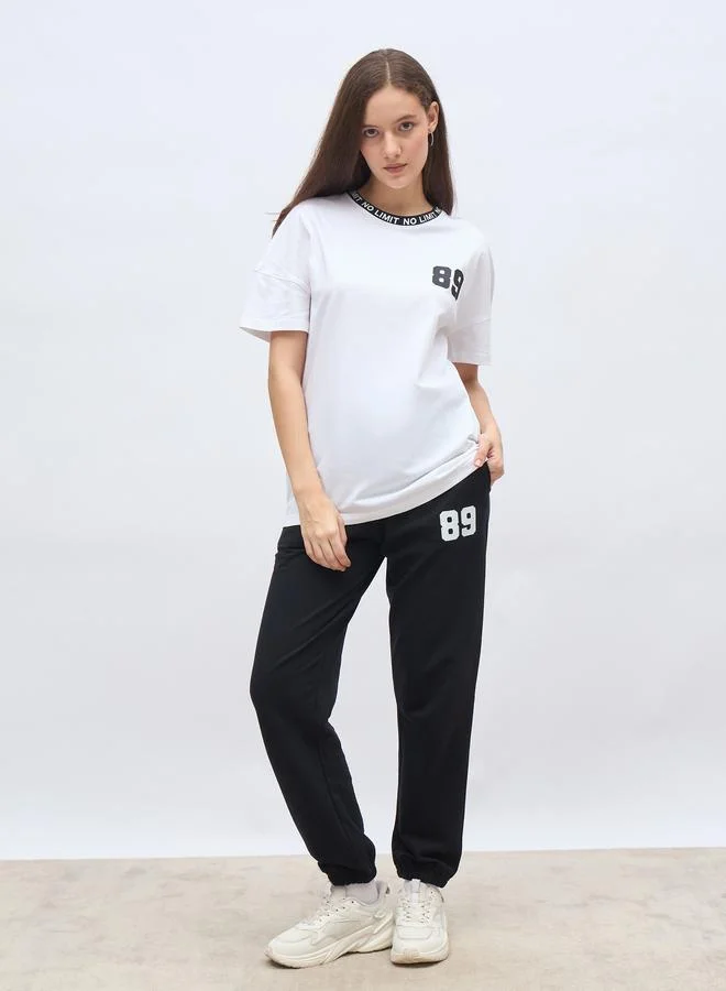 ستايلي Styli Oversized Slogan T-Shirt and Cuffed Joggers Set