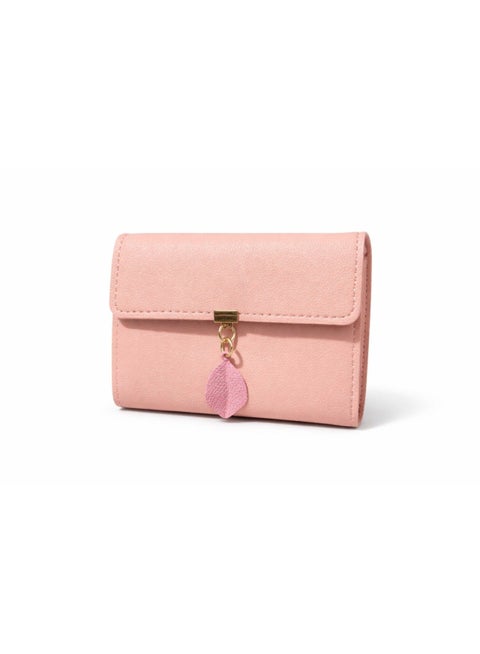 A small women's wallet made of faux leather, with a trifold design, card holder, ID window, and note pendant.