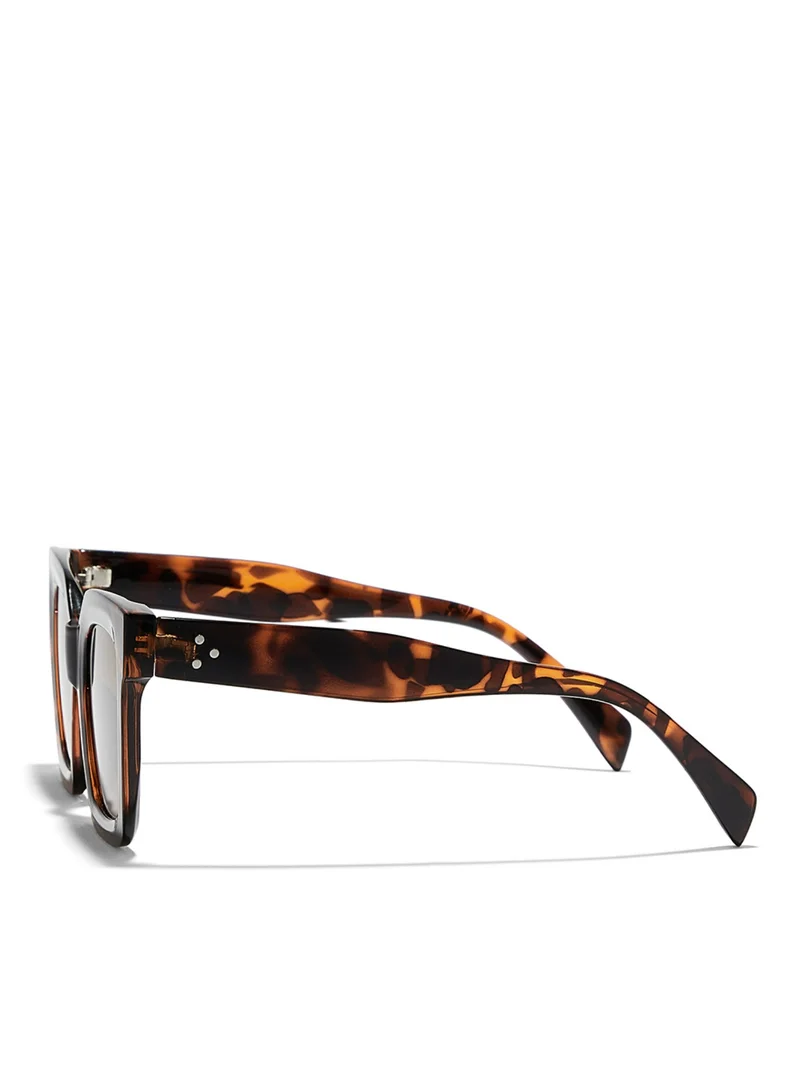 بلاك أوت TESSERA Women Tortoise Sunglasses - Frame Material: Thermoplastic Rubber (TR90)- Frame Color: Tortoise-Lens Color: Brown - Full RimTESSERA Women Tortoise Sunglasses - Frame Material: Thermoplastic Rub