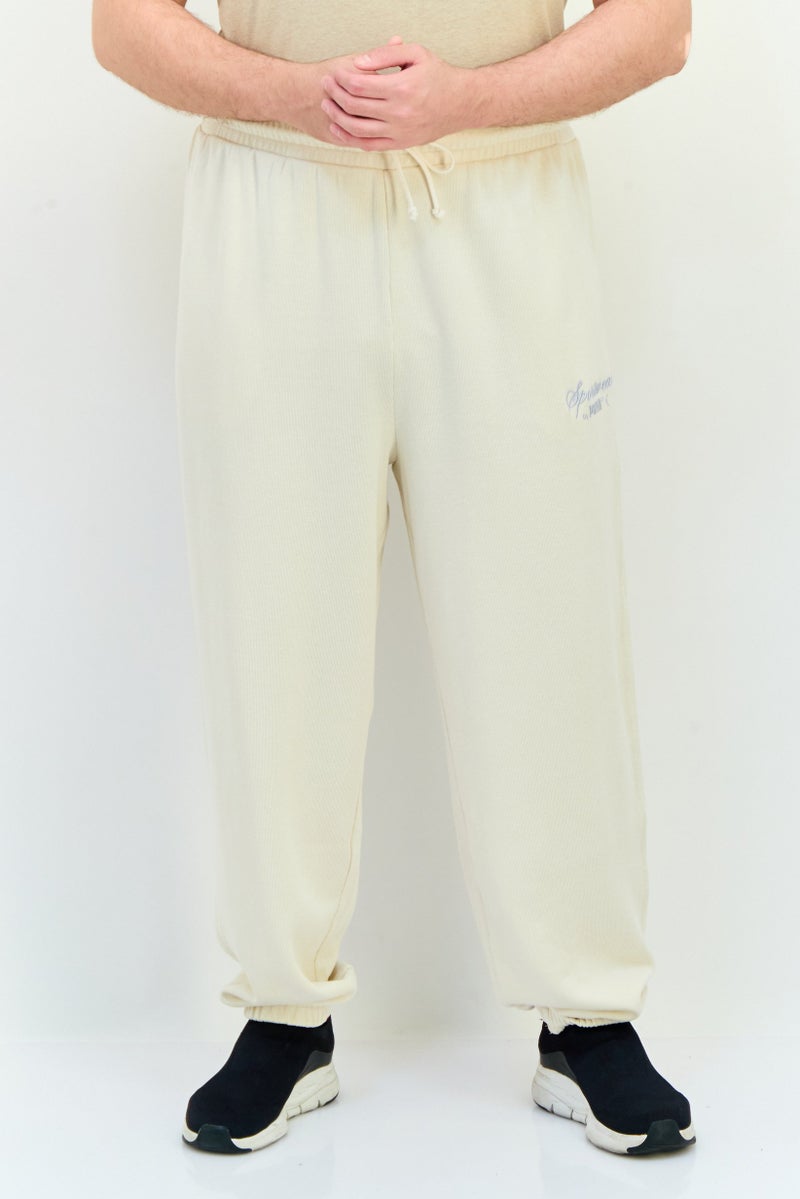 PUMA Men Sportswear Fit Outdoor Sweatpants, Beige - Image 1