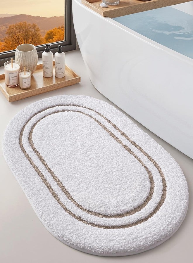 DEXI Oval Bath Mats for Bathroom, 24x36 Absorbent Bath Mat, Washable Microfiber Bathroom Rug with Non Slip Backing for Shower Floor, Beige - Image 1