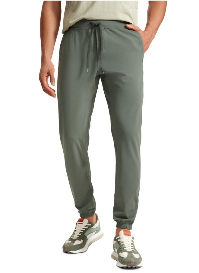 CRZ YOGA - Mens 4-Way Stretch Golf Joggers with Pockets 30" - Track Gym Athletic Workout Hiking Pants Grey Sage Large - Image 1