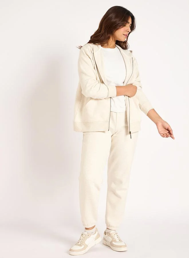 Femmella  Women Off White Melange Fleece Joggers for Women | Best Price UAE