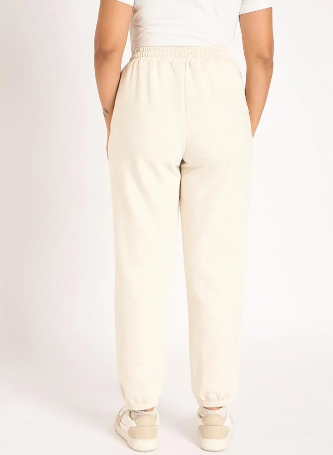 Femmella  Women Off White Melange Fleece Joggers for Women | Best Price UAE