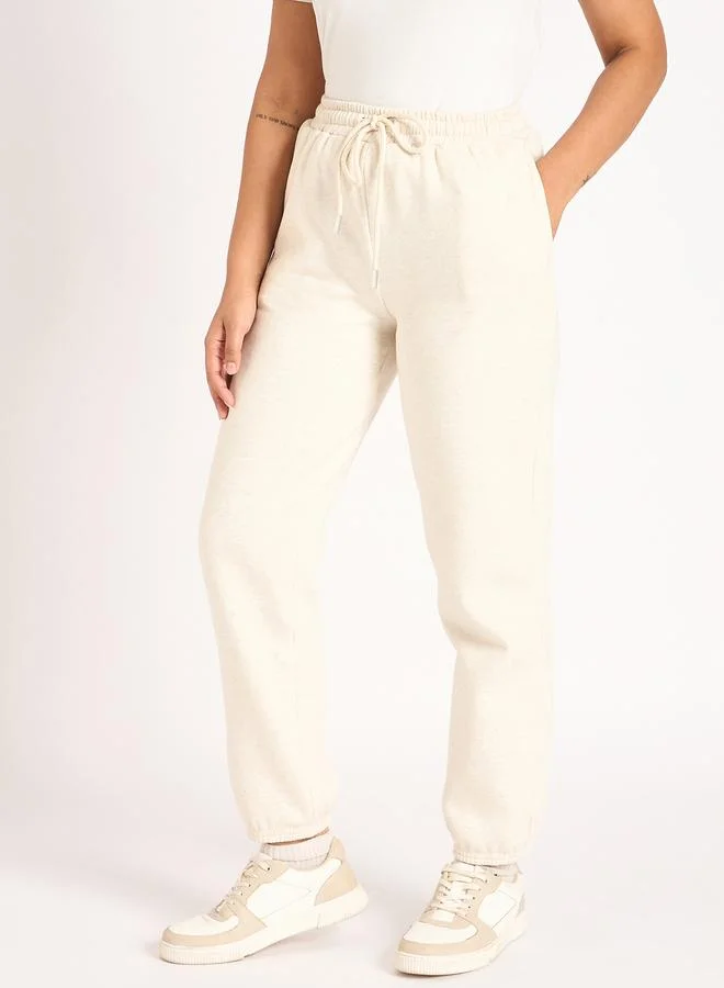 Femmella Women Off White Melange Fleece Joggers