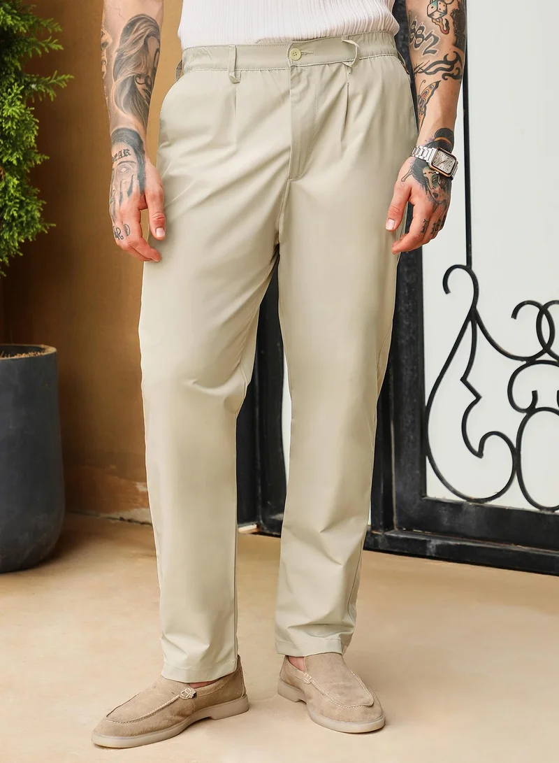 Campus Sutra Campus Sutra Men's Saltbox Beige Pleated Parachute Trousers | Mid-Rise , Straight Hem , Button Closure , Straight-Fit | Solid Plain | Polyester Trouser For Casual Wear