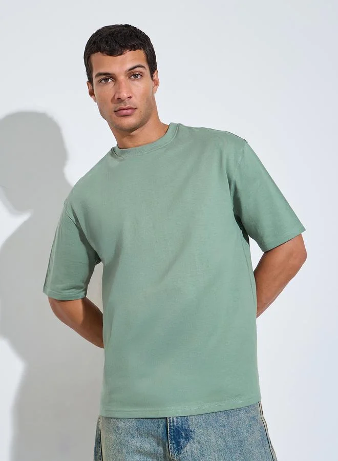 Styli Men Green Oversized Back Slogan Print Terry T-Shirt
