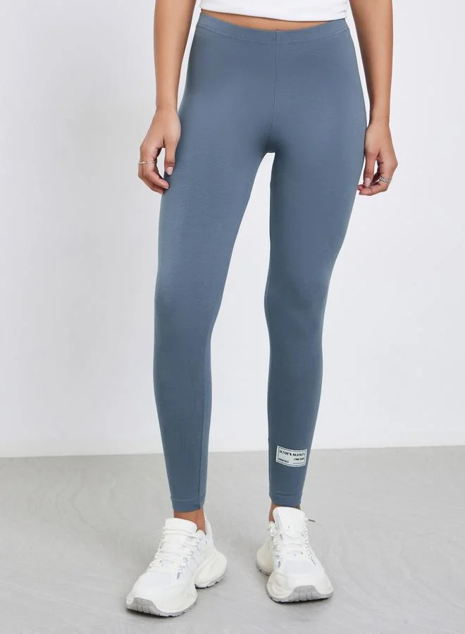 Styli Grey Plain Leggings with Badge Detail