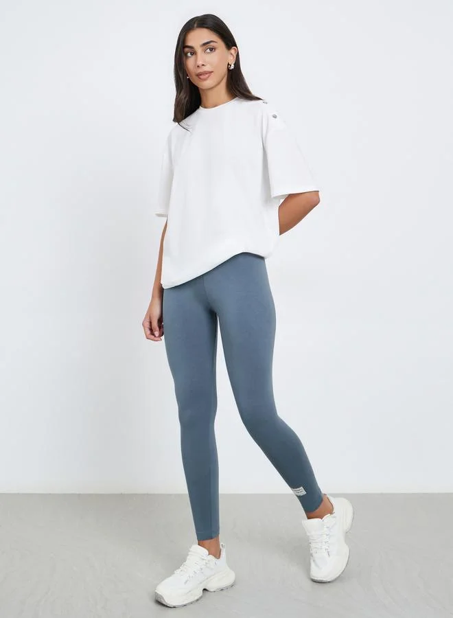 Styli Grey Plain Leggings with Badge Detail