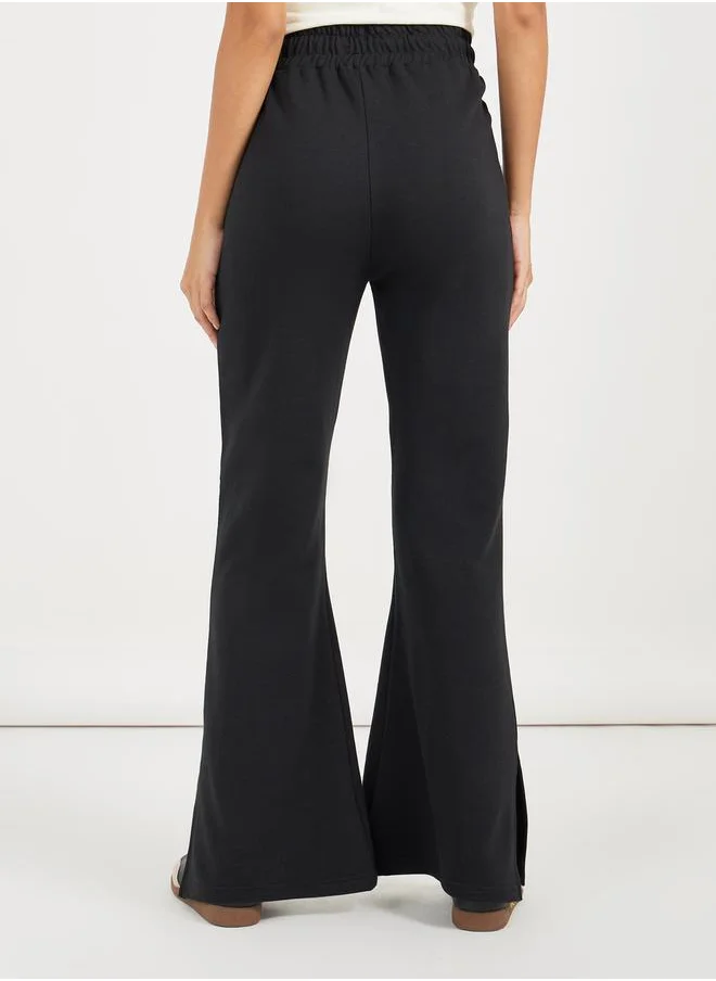 Styli Solid Drawstring Waist Flared Joggers with Side Slit