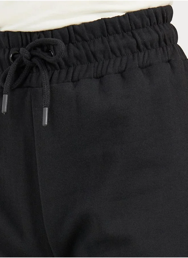 Styli Solid Drawstring Waist Flared Joggers with Side Slit