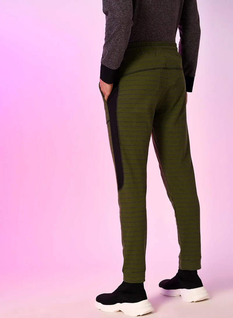 Campus Sutra Campus Sutra Men's Dark Green Striped Trackpants For Casual Wear | Angled Open Pockets | Drawstring Waist | Trackpants Crafted With Comfort Fit & High Performance For Everyday Wear