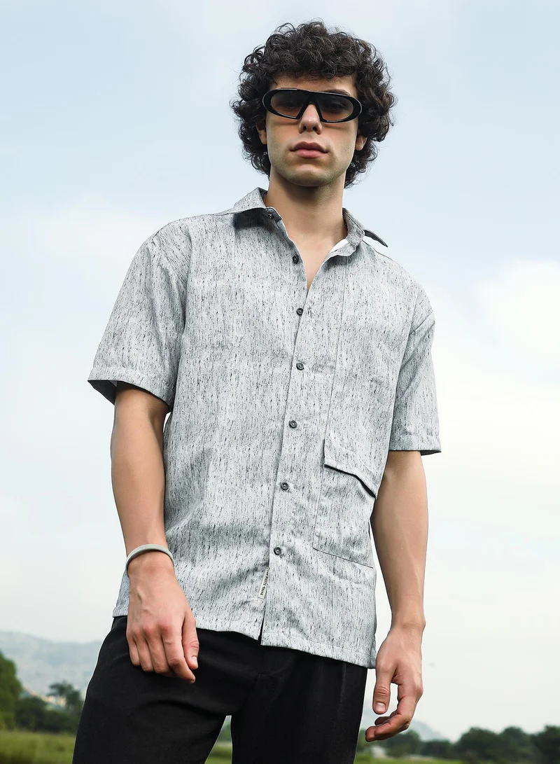 كامبوس سوترا قميص رجالي كبير الحجم بلون رمادي مرقط مع جيب