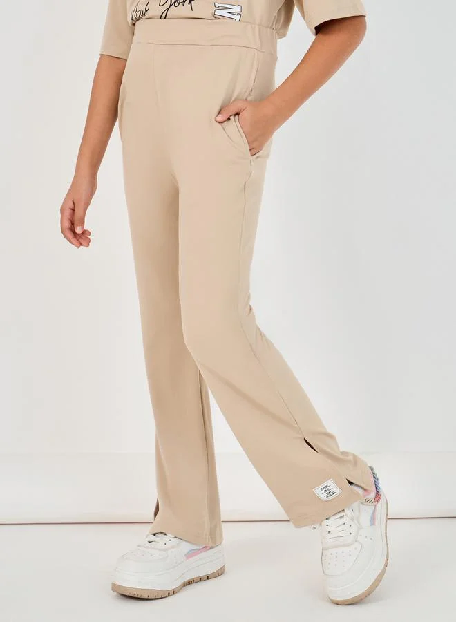 Styli Graphic Print Round Neck T-Shirt & High Rise Pants Co-Ords