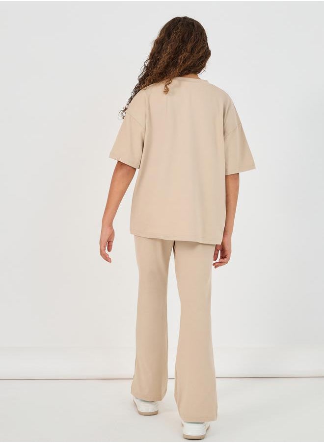 Styli Graphic Print Round Neck T-Shirt & High Rise Pants Co-Ords  - Image 5