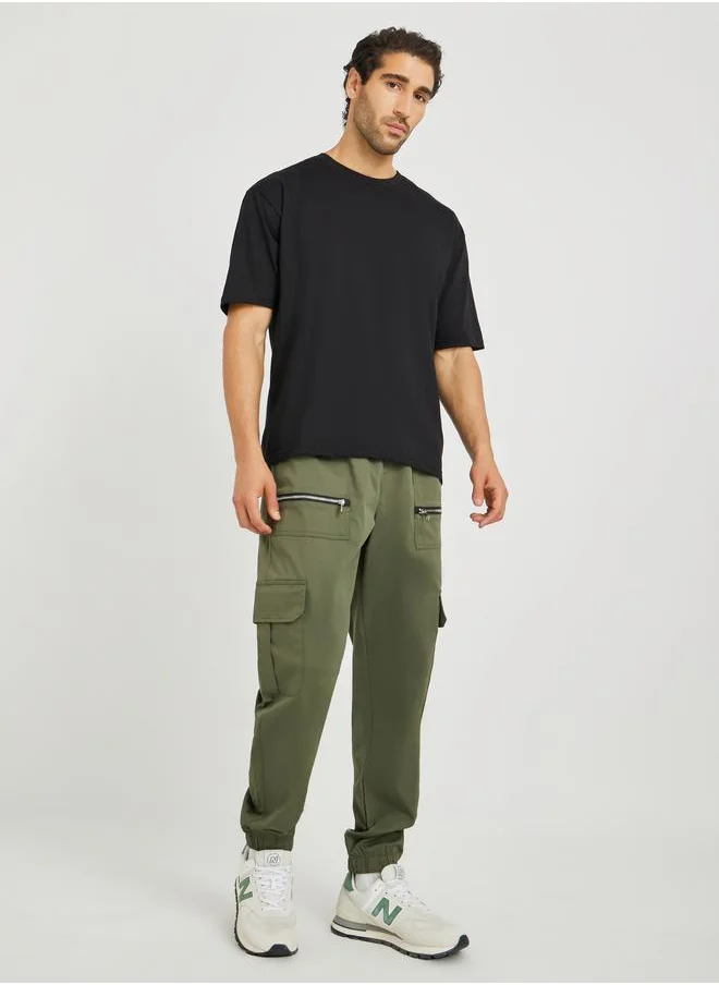 ستايلي Styli Men Olive Solid Relaxed Fit Cargo Joggers with Zipper Detail