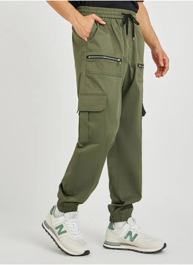 ستايلي Styli Men Olive Solid Relaxed Fit Cargo Joggers with Zipper Detail