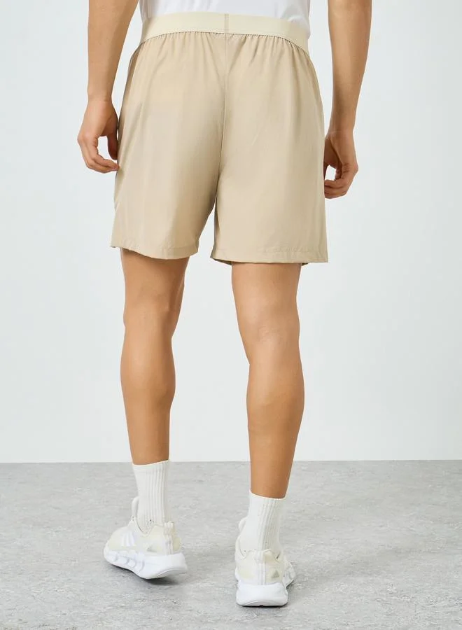 Styli Active beige Men Beige Relaxed Running Shorts for Men | Best Price UAE