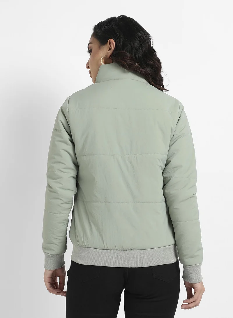Campus Sutra Women's Sage Green Puffer Jacket With Ribbed Hem For Casual Wear | High Neck  | Long Sleeve | Zipper Closure | Jacket Crafted With Comfort Fit For Everyday Wear