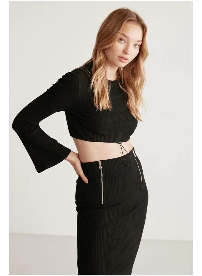 GRIMELANGE Grimelange Darlene Women's Ribbed Stretch Fabric Flare Sleeve Elastic Hem Stopper Crop Black Blouse