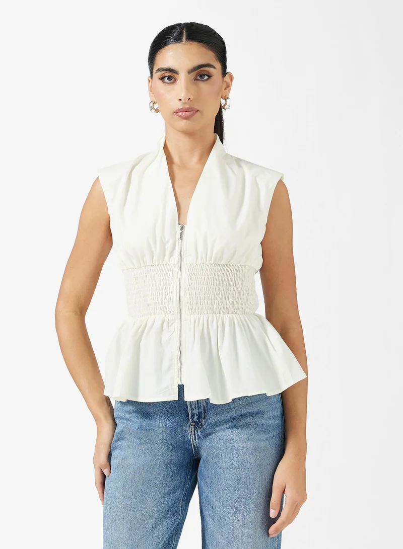 ايلا بلوزة بكسرات وسحاب أمامي